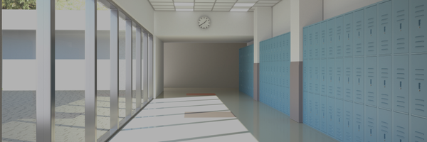 Hallway in a school. The hallway is long and narrow, with a row of lockers on one side and large windows on the other. The floor is shiny and reflective, and the ceiling is high and white. There is a clock mounted on the wall, and the overall atmosphere is clean and well-maintained.