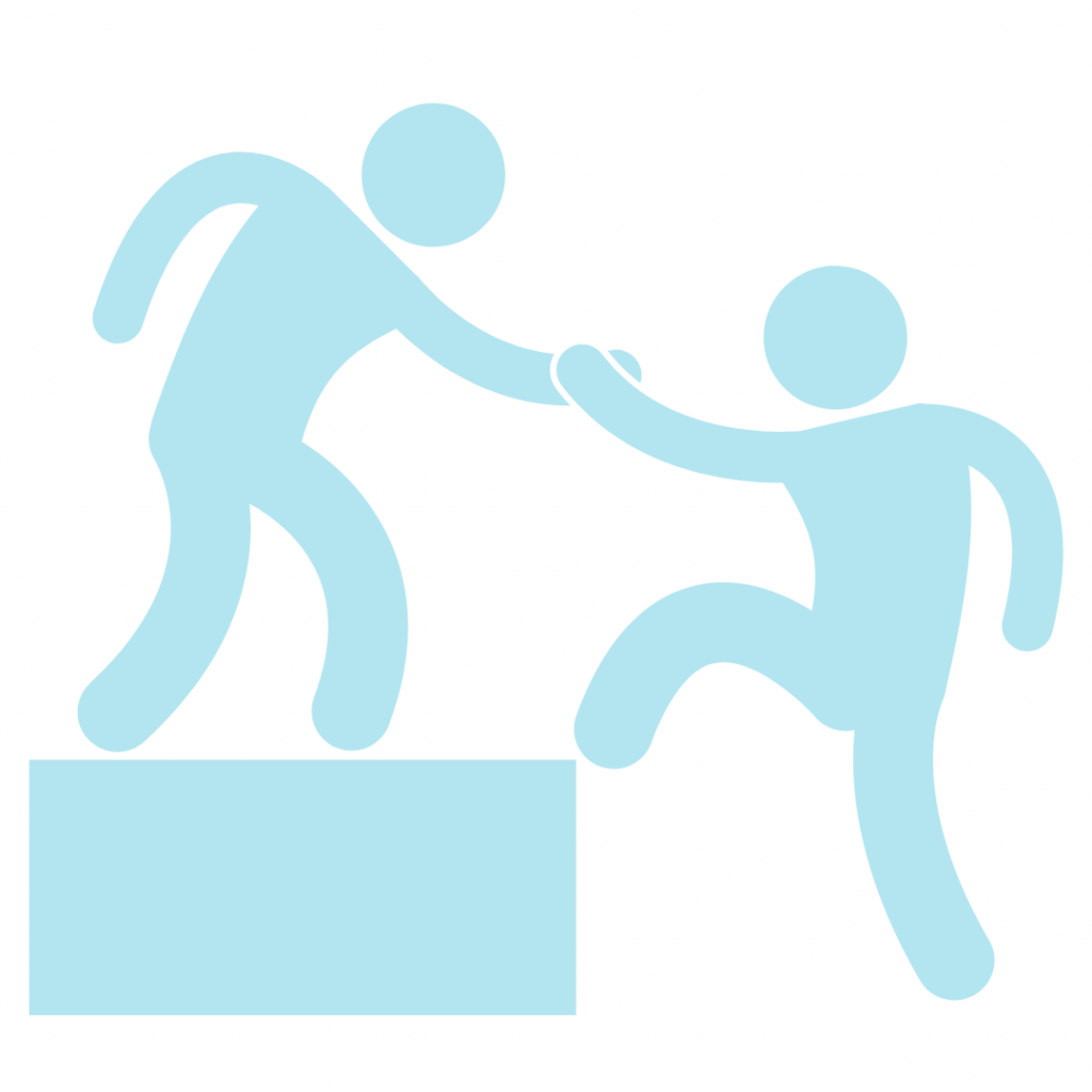 Two people helping each other. One person is standing on a platform, reaching down to help another person who is trying to climb up. This image represents assistance, cooperation, or teamwork.