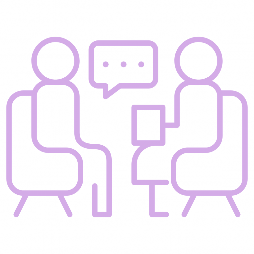 Two people having a conversation. The image shows two people sitting in chairs, facing each other with a speech bubble between them. This represents communication, discussion, or a meeting.