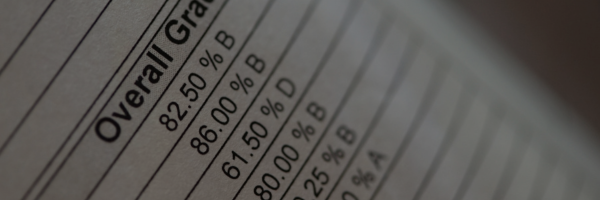 Close-up of a grade report showing overall grades, with percentages and letter grades ranging from B to D